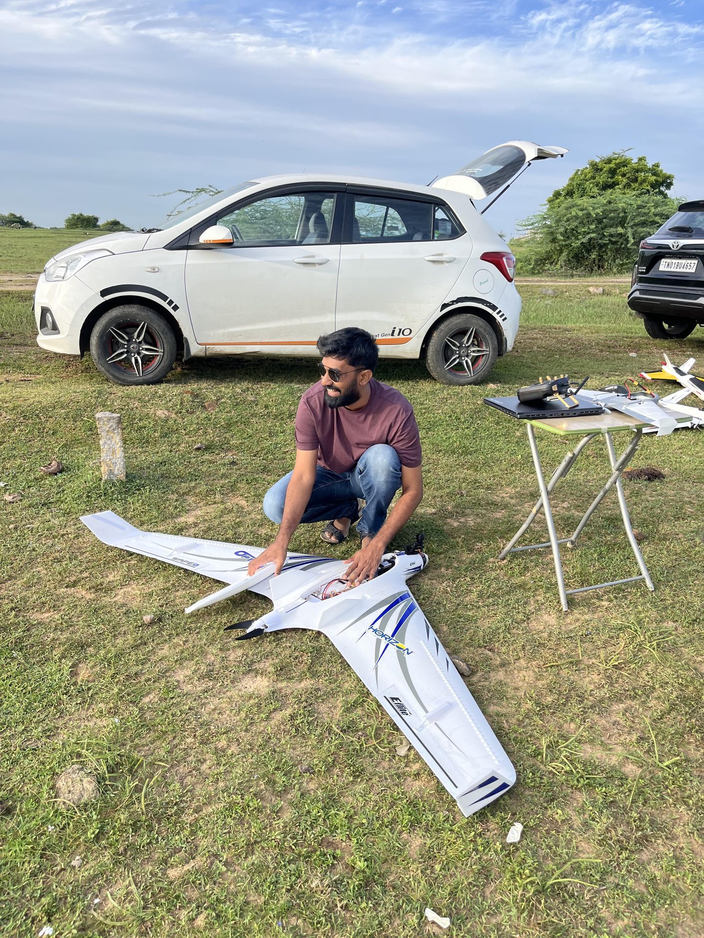 Chugilan assembling large white fixed-wing outdoors